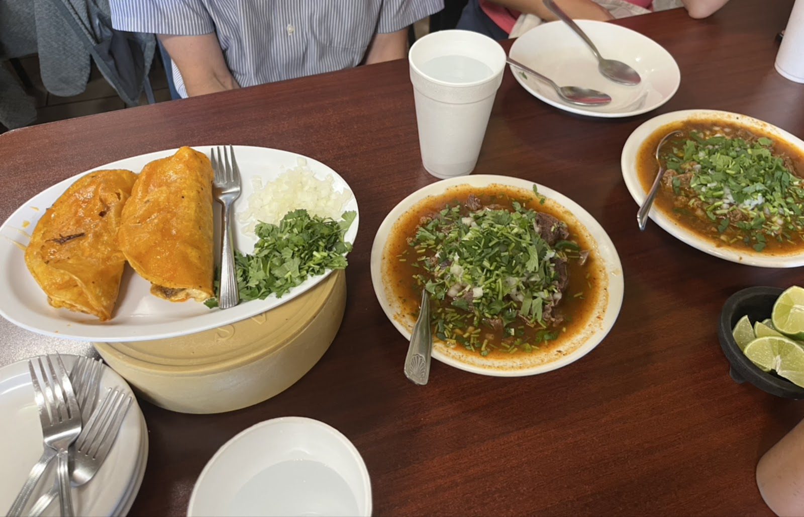 Bowls of birria and quesabirrias